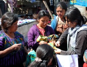 Production Coordinator, Yesica Torres, reviewing an order with Yabal's weaving cooperative.