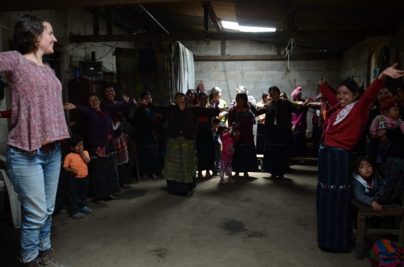 Fair trade women weavers stretching